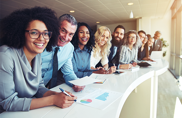 a group of executives smiling